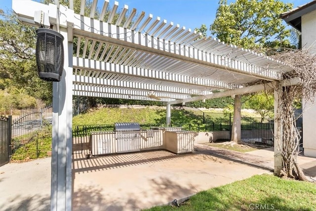 view of patio featuring grilling area, fence, and a pergola