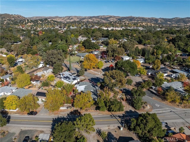 birds eye view of property featuring a mountain view