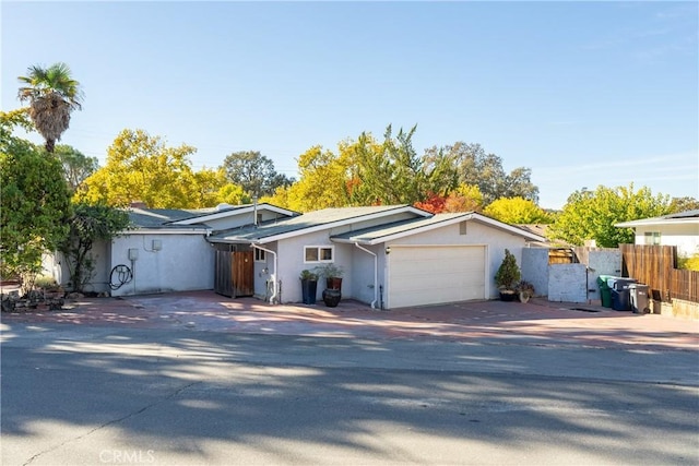 single story home featuring a garage