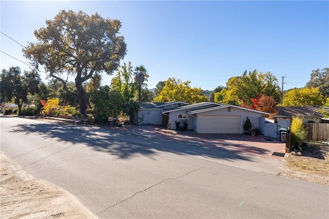 ranch-style house featuring a garage