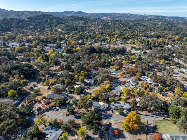 birds eye view of property with a mountain view