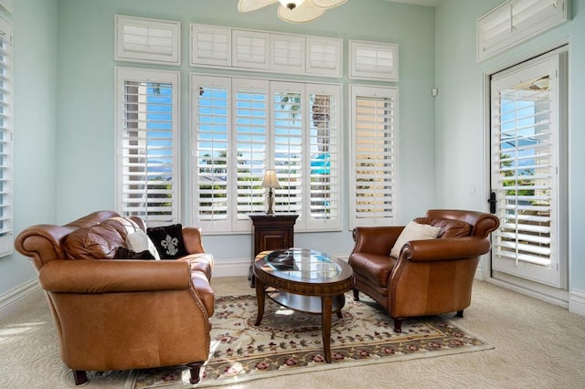 living area with light carpet