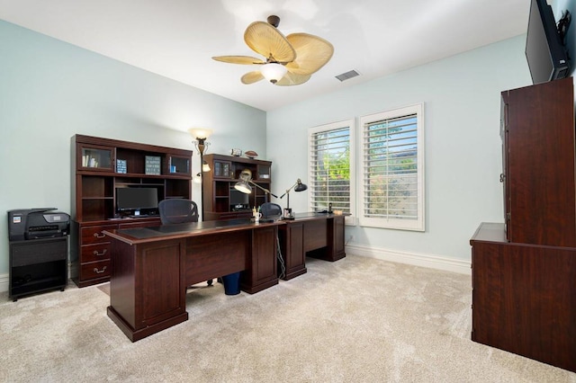 carpeted office with ceiling fan