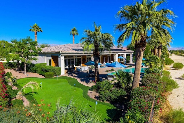 rear view of house with a patio