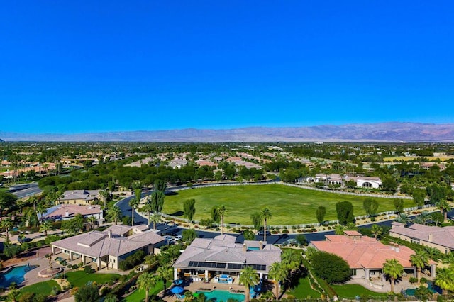 birds eye view of property with a mountain view