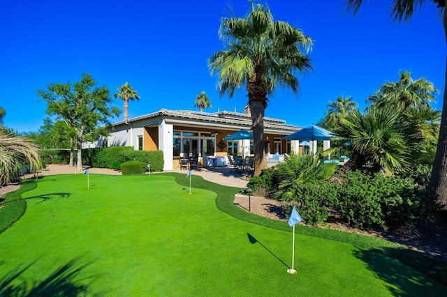 rear view of property with a patio area