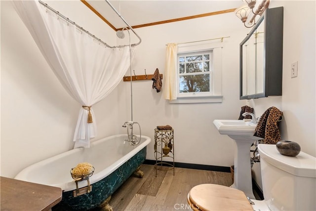 bathroom with toilet, ornamental molding, shower / bath combo, and hardwood / wood-style flooring