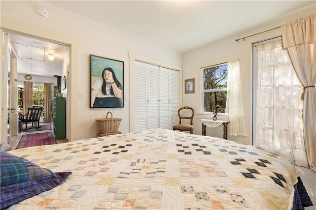 carpeted bedroom with a closet