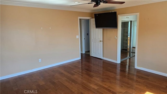 unfurnished room featuring ceiling fan, dark hardwood / wood-style floors, and ornamental molding