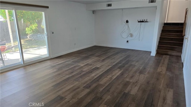 unfurnished room with dark hardwood / wood-style floors