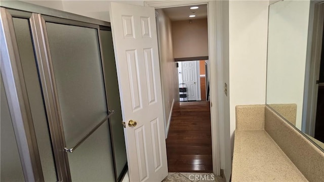 hallway featuring hardwood / wood-style floors