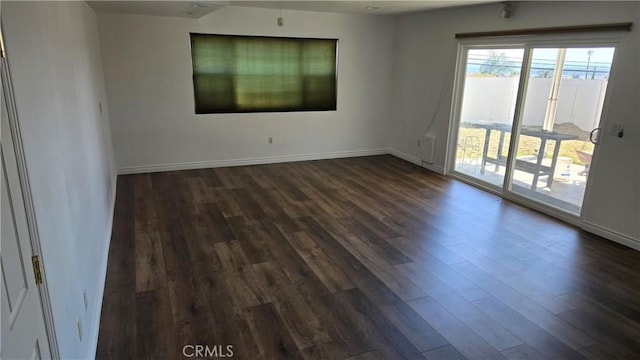 empty room with dark wood-type flooring