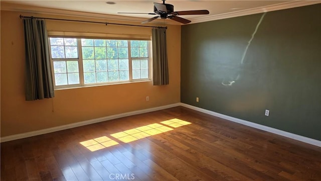 empty room featuring dark hardwood / wood-style floors, ceiling fan, and crown molding