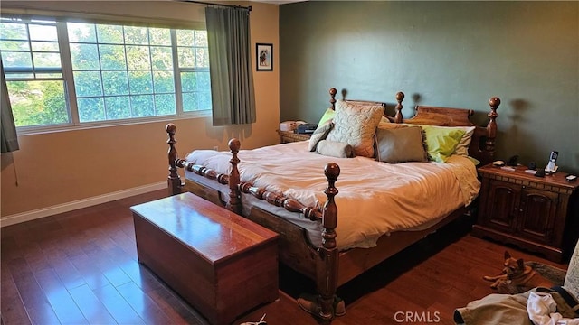 3930 Ironwood St, San Bernardino, CA 92404 - bedroom featuring dark wood-style flooring and baseboards