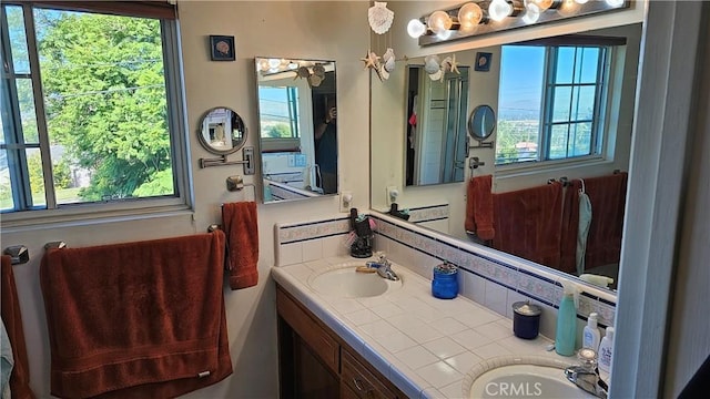 bathroom with vanity and a wealth of natural light