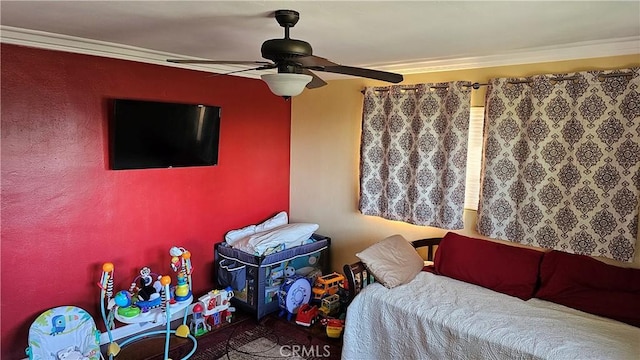 bedroom with ceiling fan and ornamental molding