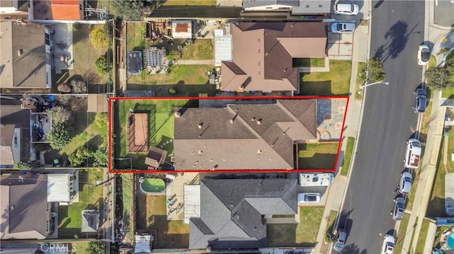 birds eye view of property with a residential view