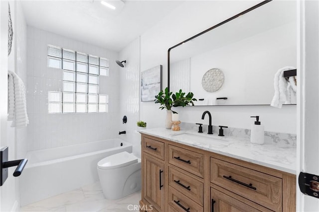 full bathroom featuring vanity, tiled shower / bath combo, and toilet