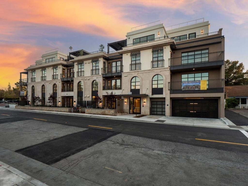 view of outdoor building at dusk