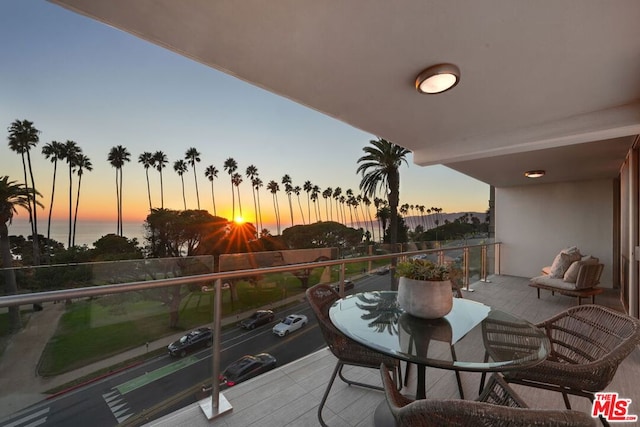 balcony at dusk with a water view