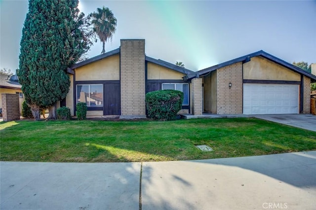 view of front of house featuring a garage and a front yard