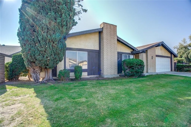 view of front facade with a front yard and a garage