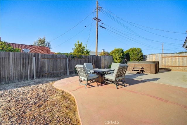 view of patio / terrace featuring a hot tub