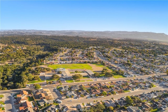 birds eye view of property with a mountain view