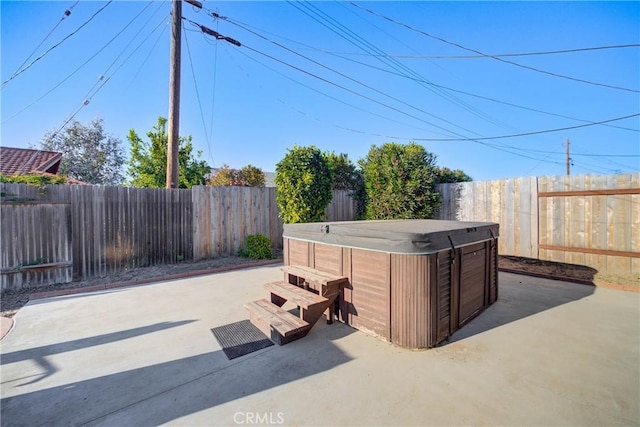 view of patio with a hot tub