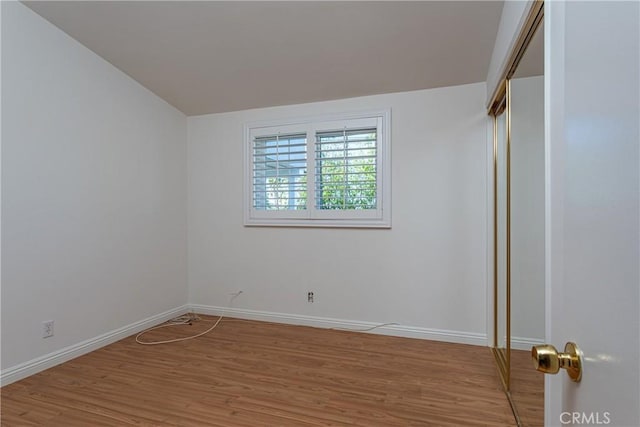 unfurnished room featuring wood-type flooring