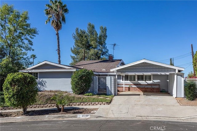 single story home featuring a carport