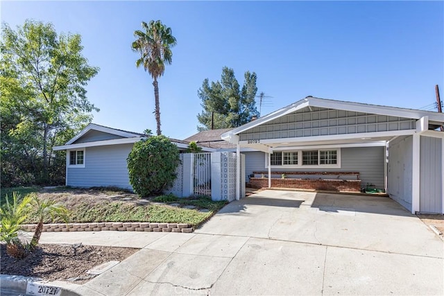 ranch-style home with a carport