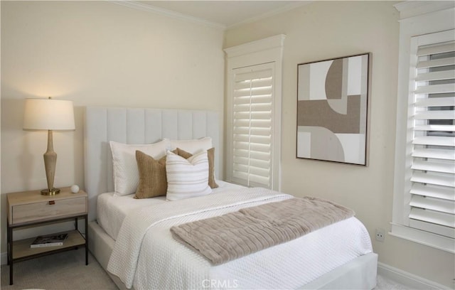 bedroom with carpet flooring and ornamental molding