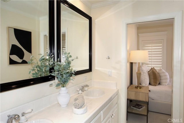 bathroom with vanity and ornamental molding