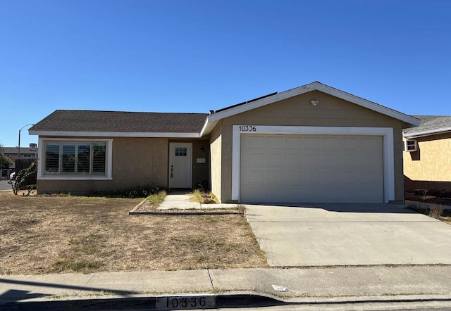 single story home featuring a garage