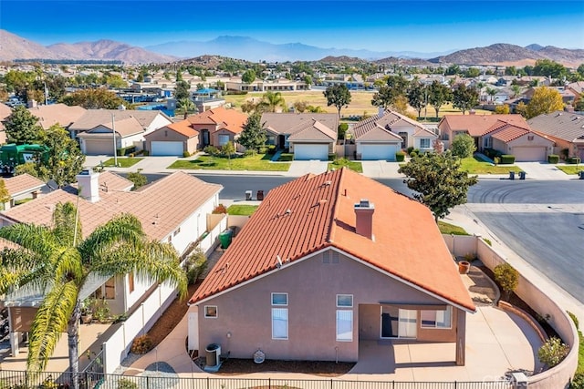 birds eye view of property with a residential view and a mountain view