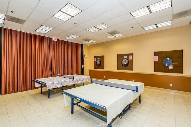 game room with a drop ceiling and tile patterned floors