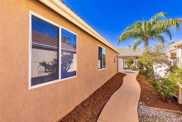 view of side of home featuring stucco siding