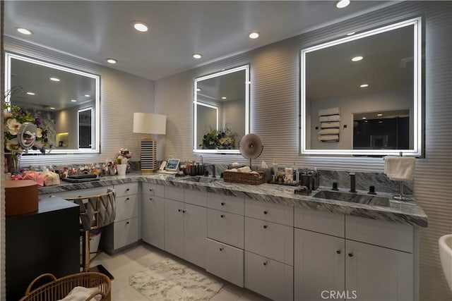 bathroom featuring tile patterned flooring and vanity