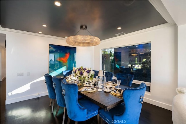 dining room featuring dark hardwood / wood-style floors and crown molding