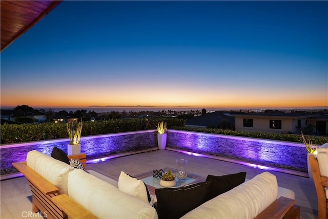 view of pool at dusk