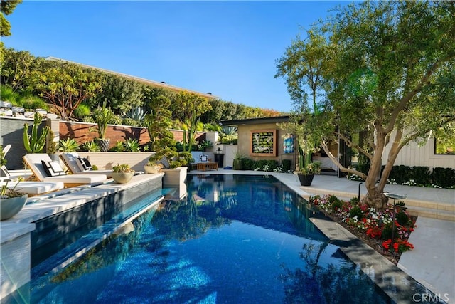 view of pool featuring a patio area