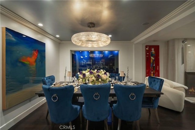 interior space featuring dark hardwood / wood-style flooring, an inviting chandelier, and crown molding