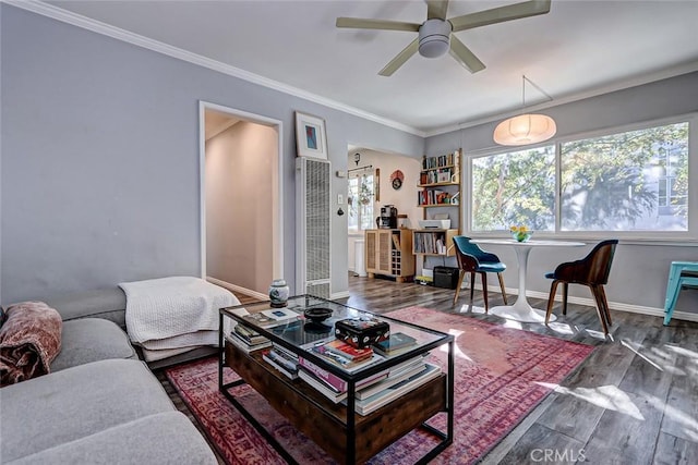 living room featuring crown molding, dark hardwood / wood-style flooring, and ceiling fan