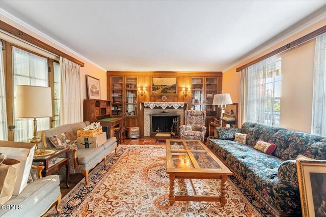 living room with wood-type flooring and ornamental molding