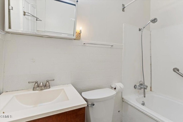 full bathroom with bathing tub / shower combination, vanity, and toilet