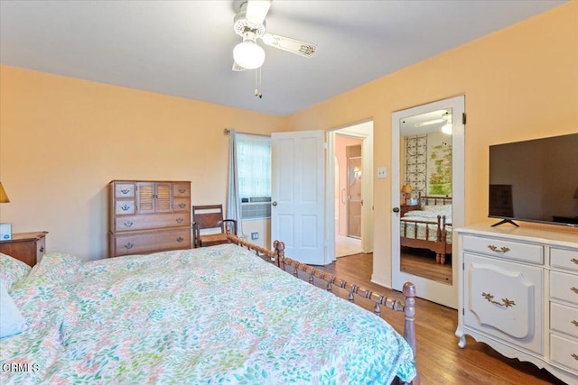 bedroom with ceiling fan and hardwood / wood-style floors