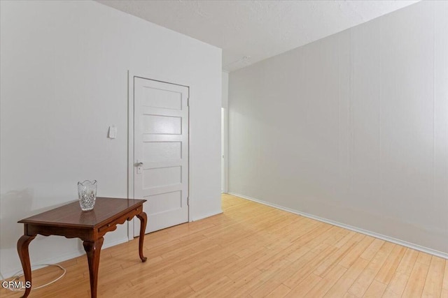 unfurnished room with light hardwood / wood-style floors