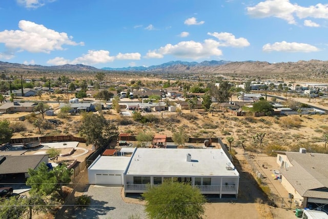 birds eye view of property featuring a mountain view