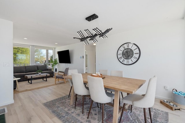 dining room with light hardwood / wood-style flooring